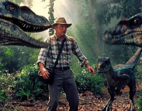 Tres velociraptors rodeando a Alan
