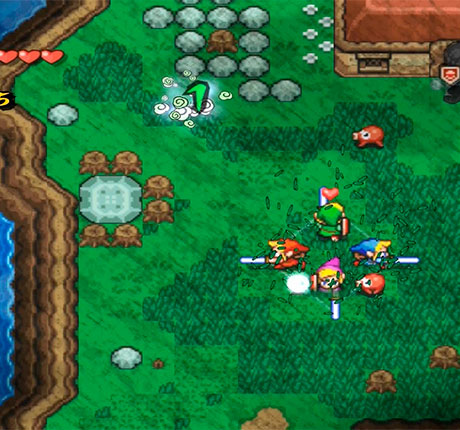 The Legend of Zelda Four Sword Adventures los 4 links cortando hierbas