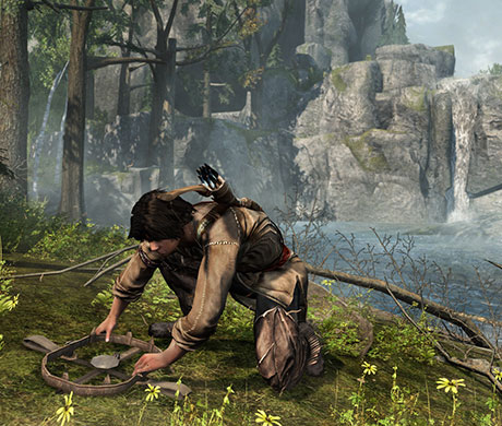 Imagen de Connor poniendo una trampa para osos en el juego Assassin's Creed III.