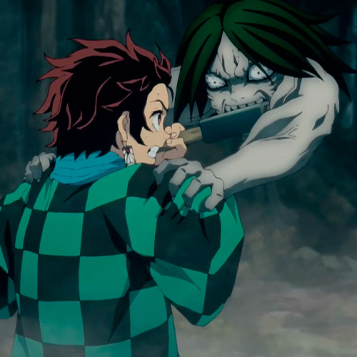Imagen de tanjiro atacando a un demonio en el anime kimetsu no yaiba.