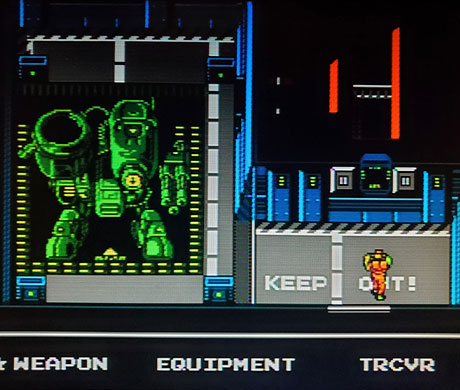 Imagen de Snake al lado de un Metal Gear en el juego Snake's Revenge.