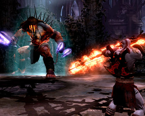 Imagen de Kratos enfrentándose a Hades en el juego God of War III.