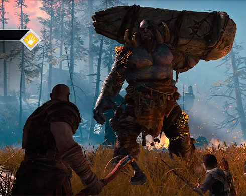 Imagen de Kratos y Atreus enfrentándose a un Ogro en el juego God of War.